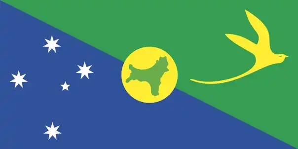 The flag of Christmas Island is divided diagonally from the upper hoist to the lower fly. The lower, hoist-side triangle is blue for the sea and carries the white stars of the Southern Cross; the upper, fly-side triangle is green for the land and carries the Golden Bosun bird that symbolises the island. At the centre, a gold disc holds a green silhouette map of the island, a nod to its phosphate-mining heritage.