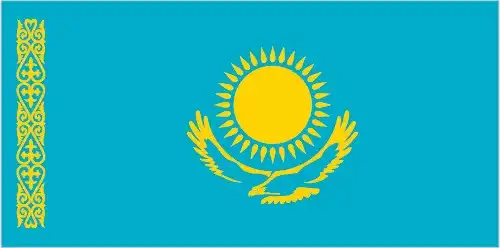 The flag of Kazakhstan features a turquoise-blue field centered with a gold sun of thirty-two rays above a golden steppe eagle in flight. Along the hoist is a vertical ornamental band called 'koshkar‑muiz' (ram’s horns) in gold, representing Kazakh cultural artistry.