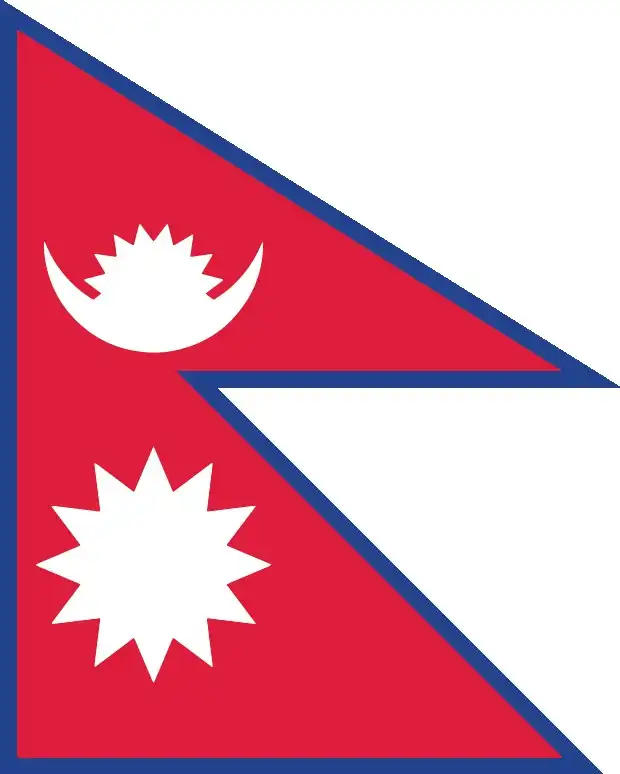 Nepal’s flag is the world’s only non‑rectangular national flag: two stacked triangular pennants with crimson red bodies and blue borders, bearing a stylized white moon with eight rays and a twelve‑ray sun. Its unique shape conveys cultural identity and cosmic symbolism.