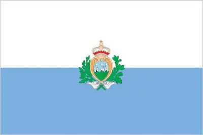 San Marino’s flag consists of two horizontal bands—white over light blue—with the national coat of arms centered. The white symbolizes peace and the snow covering Mount Titano, while the blue represents liberty and sky.