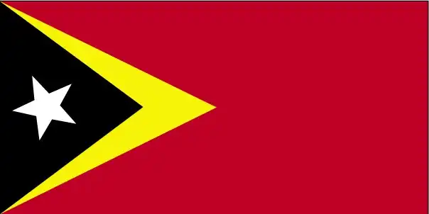 Timor‑Leste’s flag features a red field with overlapping yellow and black isosceles triangles at the hoist, centered by a white five‑pointed star—symbolizing the nation rising from colonial oppression.